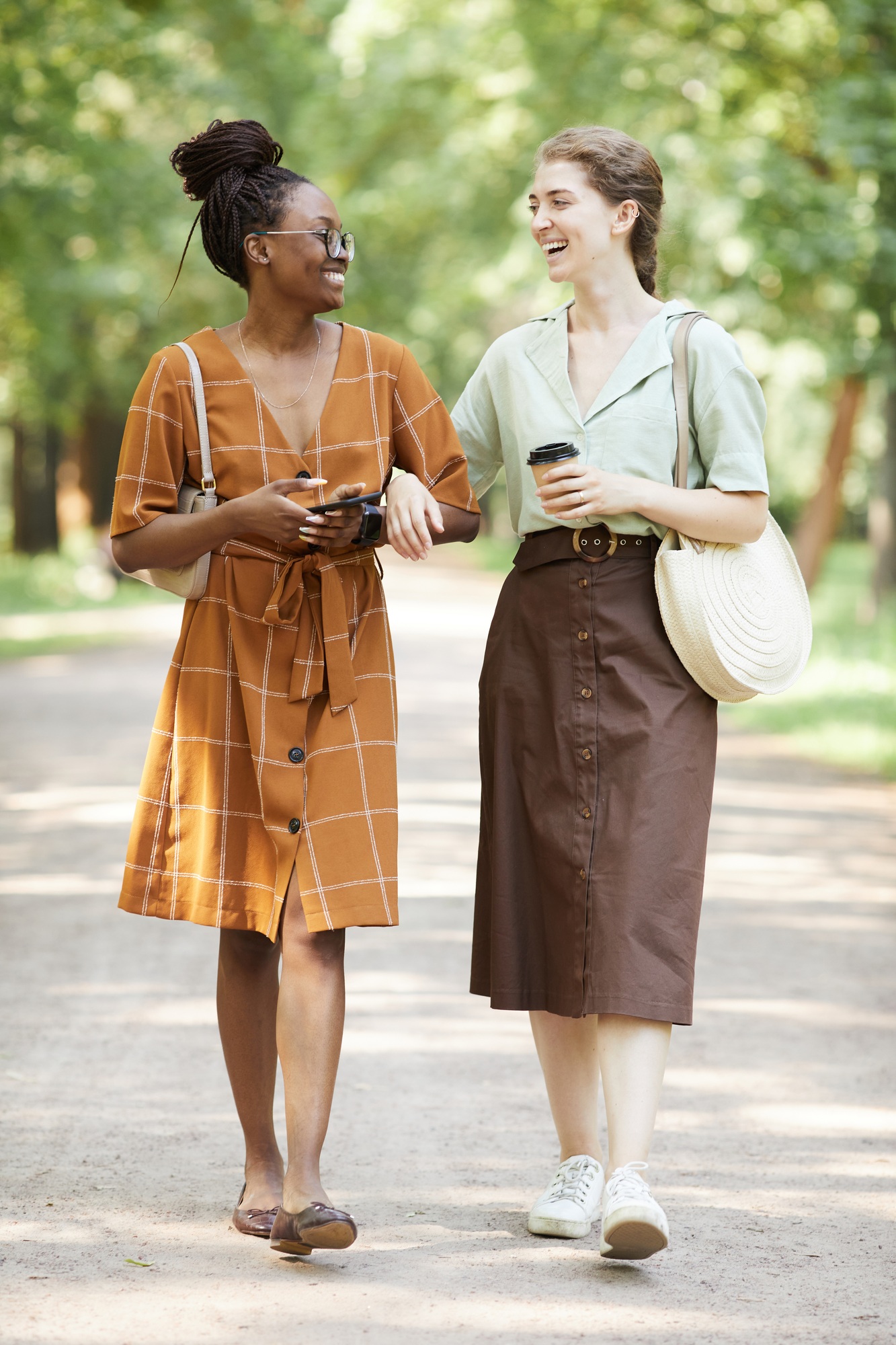 Two Smiling Young Women in Park